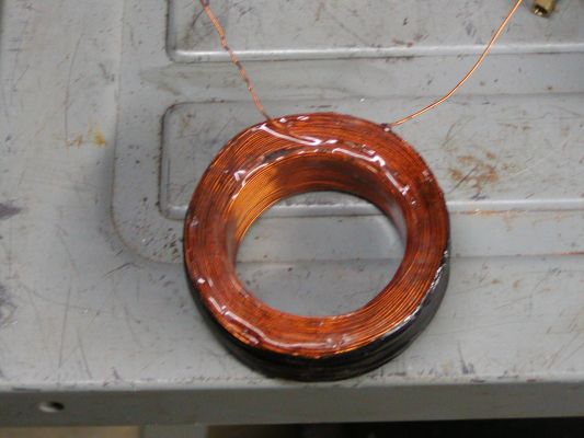 Click to view full size image
 ============== 
Rotor Coil
New wound rotor coil after coating with epoxy, before taping and mounting in rotor.
