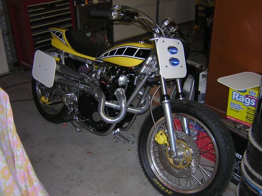 Click to view full size image
 ============== 
Street tracker built by me out of $40 junkyard special.  750 Shell top end with extensive port work and trick parts.  Set up for AHRMA racing but still street legal.

