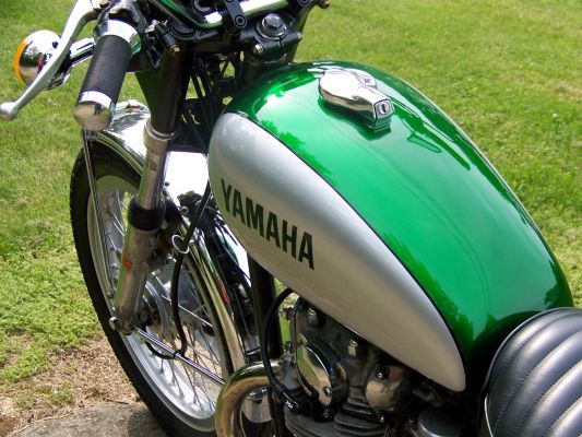 Click to view full size image
 ============== 
1975 Yamaha XS650
Tank shot after restoration..... PPG Vibrance Indianapolis Green (variant shade of candy apple green) over PPG bright Gold metallic with PPG Bright silver teardprops......
Keywords: 1975 XS650 restored