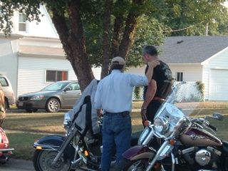 Bsquared praying with a Harley owner...
Keywords: Biker Sunday