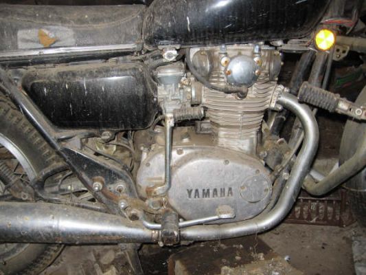 Click to view full size image
 ============== 
Right Side engine
So it was now 2006 and I was 25.  I decided to finally get the bike up and running again.  I brought it up to my home in Duluth, MN where I spent six months restoring it.
