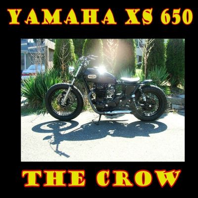 Click to view full size image
 ============== 
THE CROW
This one is a 1979 Yamaha XS 650 with a 1971 XS-1 tank.
engine has been upgraded with a PAMCO ignition unit.
Small chopper type head light...speedo only...Bates style solo seat...wrapped early type stock pipes with turn-out mufflers

