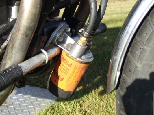 Click to view full size image
 ============== 
mods to oil for filter and cooler
this is the filter I am using and the Perma-Cool filter mount, a home made plate to attach the mount to front engine mount.
