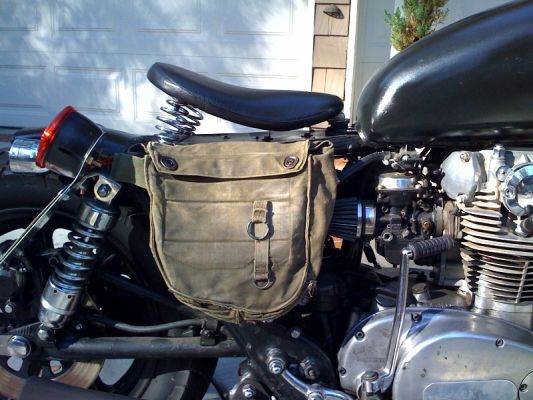 Click to view full size image
 ============== 
Bag
Gotta love vietnam gas mask saddlebags
